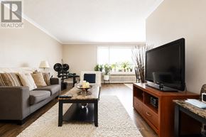 Toronto (Beechborough-Greenbrook) multi-family for rent - A living room with a couch, coffee table, and television.