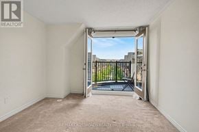 Toronto (L'amoreaux) townhouse for rent - A room with a sliding door leading to a balcony.