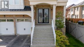 King (King City) apartment for rent - A house with a garage and a covered entrance.