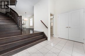 King (King City) apartment for rent - A spacious foyer with a staircase and white walls.
