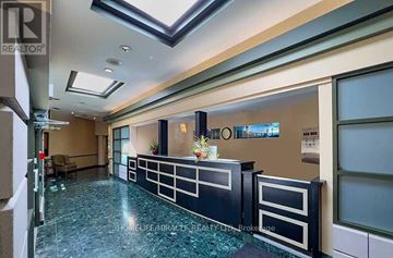 Mississauga (City Centre) condo for rent - A spacious kitchen with a blue tiled floor and a skylight above.