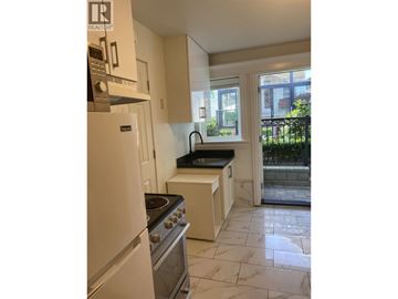 Vancouver apartment for rent - A kitchen with a stove and oven built into the cabinetry.