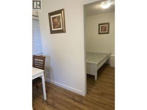 Vancouver apartment for rent - A room with a bed and a chair.
