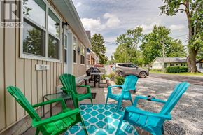 Fort Erie (Crystal Beach) duplex for rent - A patio with green chairs and a table is shown.