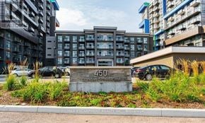 Hamilton (Waterdown) condo for rent - A sign for 450 Dundas Street East is in front of a building.