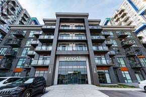 Hamilton (Waterdown) condo for rent - The image shows a modern building with the name "trend" on the entrance.
