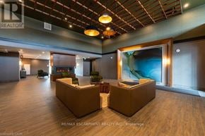 Hamilton (Waterdown) condo for rent - A reception area with two couches and a large painting on the wall.