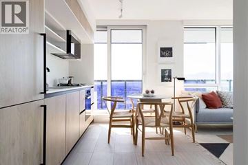 Vancouver apartment for rent - A modern kitchen with a dining table and chairs.