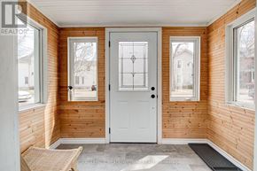 Guelph (Downtown) multi-family for rent - A white door with a diamond pattern in the middle is the focal point of this image.