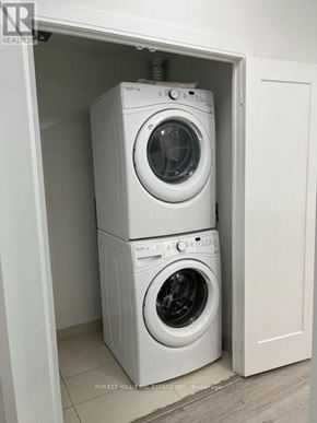 Toronto (Forest Hill South) house for rent - Two white washing machines in a small cabinet.