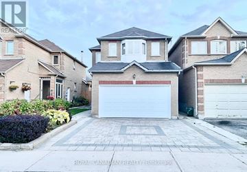 Markham (Middlefield) apartment for rent - A house with a white garage door is for sale.