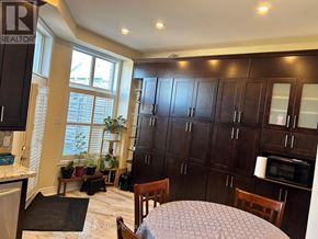 Markham (Cornell) townhouse for rent - A dining room with a table and chairs.