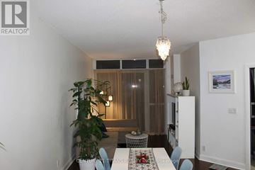 Mississauga (City Centre) condo for rent - A living room with a dining table and chairs.