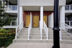 Kitchener townhouse for rent - A building with a red brick wall and yellow doors.