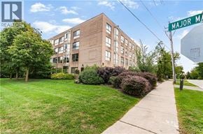 Richmond Hill apartment for rent - A building with a lawn in front of it.