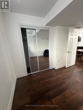 Halton Hills (Georgetown) apartment for rent - A room with a wooden floor and a white door.