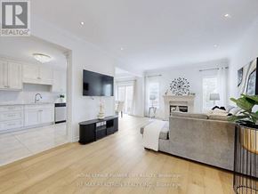 Vaughan (Maple) apartment for rent - A modern living room with a grey sofa and a television.
