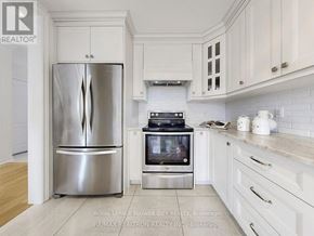 Vaughan (Maple) apartment for rent - A kitchen with a stainless steel refrigerator and oven.