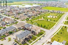 Ottawa townhouse for rent - An aerial view of a residential area with a road and houses.