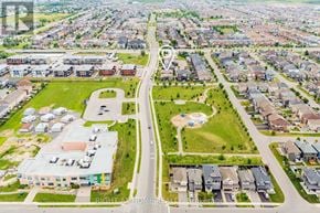Ottawa townhouse for rent - A bird's eye view of a residential area with a road running through it.