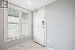 Ottawa townhouse for rent - A white door with a window above it in a room.