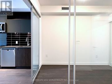 Toronto (Waterfront Communities) condo for rent - A kitchen with a dishwasher and a refrigerator.