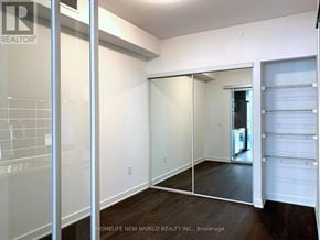 Toronto (Waterfront Communities) condo for rent - A room with a sliding door and a tiled wall.