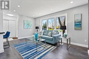 Niagara Falls (Ascot) apartment for rent - A living room with a blue couch and a glass coffee table.