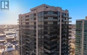 Mississauga (Clarkson) condo for rent - A tall building with many windows is under construction.
