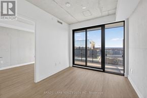 Toronto (Moss Park) condo for rent - A room with a view of the city through large windows.