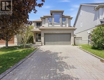 London East (East A) apartment for rent - A house with a garage and a driveway is for sale.