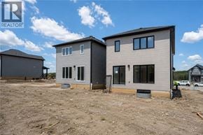Kitchener apartment for rent - A realtor logo is visible on a house under construction.