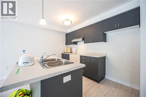 Kitchener apartment for rent - A bathroom with a white toilet and a walk in shower.