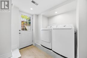 Toronto (South Parkdale) apartment for rent - A laundry room with a washer and dryer.