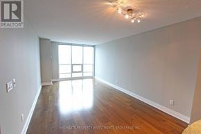 Toronto (Bay Street Corridor) condo for rent - A room with wooden floors and a large window.