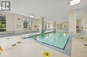 Mississauga (Rathwood) condo for rent - A large indoor swimming pool with a glass bottom.