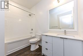 Toronto (Kingsway South) condo for rent - A white bathroom with a toilet, sink, and bathtub.