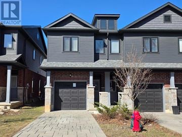Hamilton (Gibson) townhouse for rent - A house with a red fire hydrant in front of it.