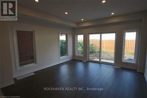 Hamilton (Gibson) townhouse for rent - A room with a large window and sliding glass doors.