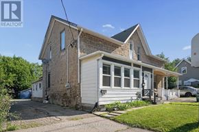 Cambridge multi-family for rent - A house with a white garage door is for sale.