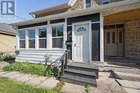 Cambridge multi-family for rent - A house with a white door and a small porch.