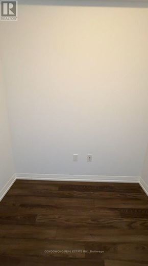 Toronto (Henry Farm) condo for rent - A room with wooden flooring and a white wall.