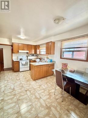 Mississauga (Malton) apartment for rent - A kitchen with a tile floor and wooden cabinets.