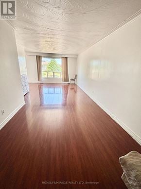Mississauga (Malton) apartment for rent - A room with wooden flooring and a window.