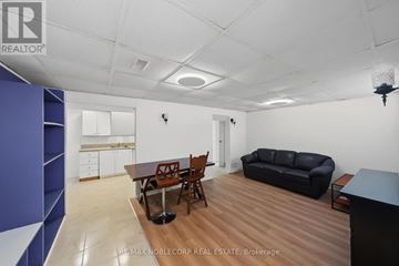 Bradford West Gwillimbury (Bradford) apartment for rent - A living room with a dining table and chairs.