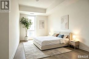 Toronto (Regent Park) condo for rent - A well-lit bedroom with a large bed and a small potted plant.