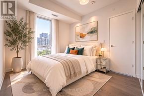 Toronto (Regent Park) condo for rent - A bedroom with a large bed and a plant in a black pot.