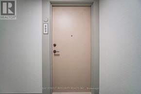 Toronto (Regent Park) condo for rent - A door with a handle and a lock is closed.