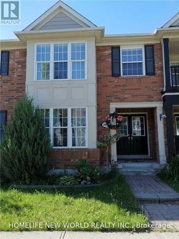 Markham (Cornell) townhouse for rent - A brick house with a white window and a black door.
