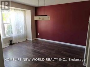 Markham (Cornell) townhouse for rent - A room with red walls and wooden flooring is on the market with Homelife New World Realty Inc.